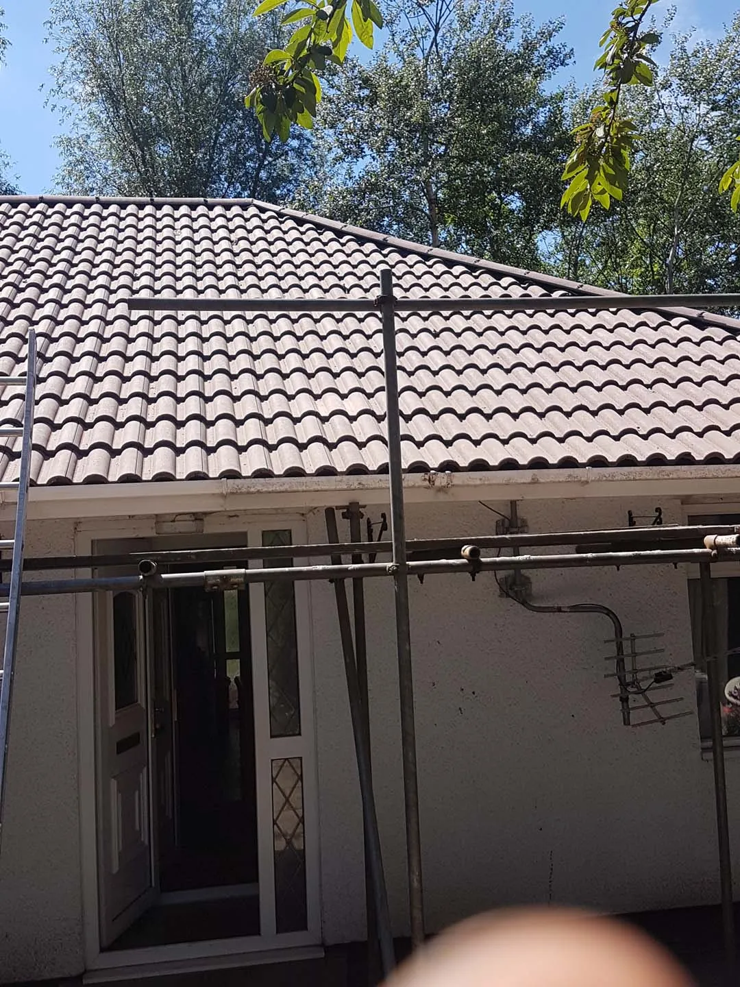 Finished Double Roman tiled bungalow roof above the front door