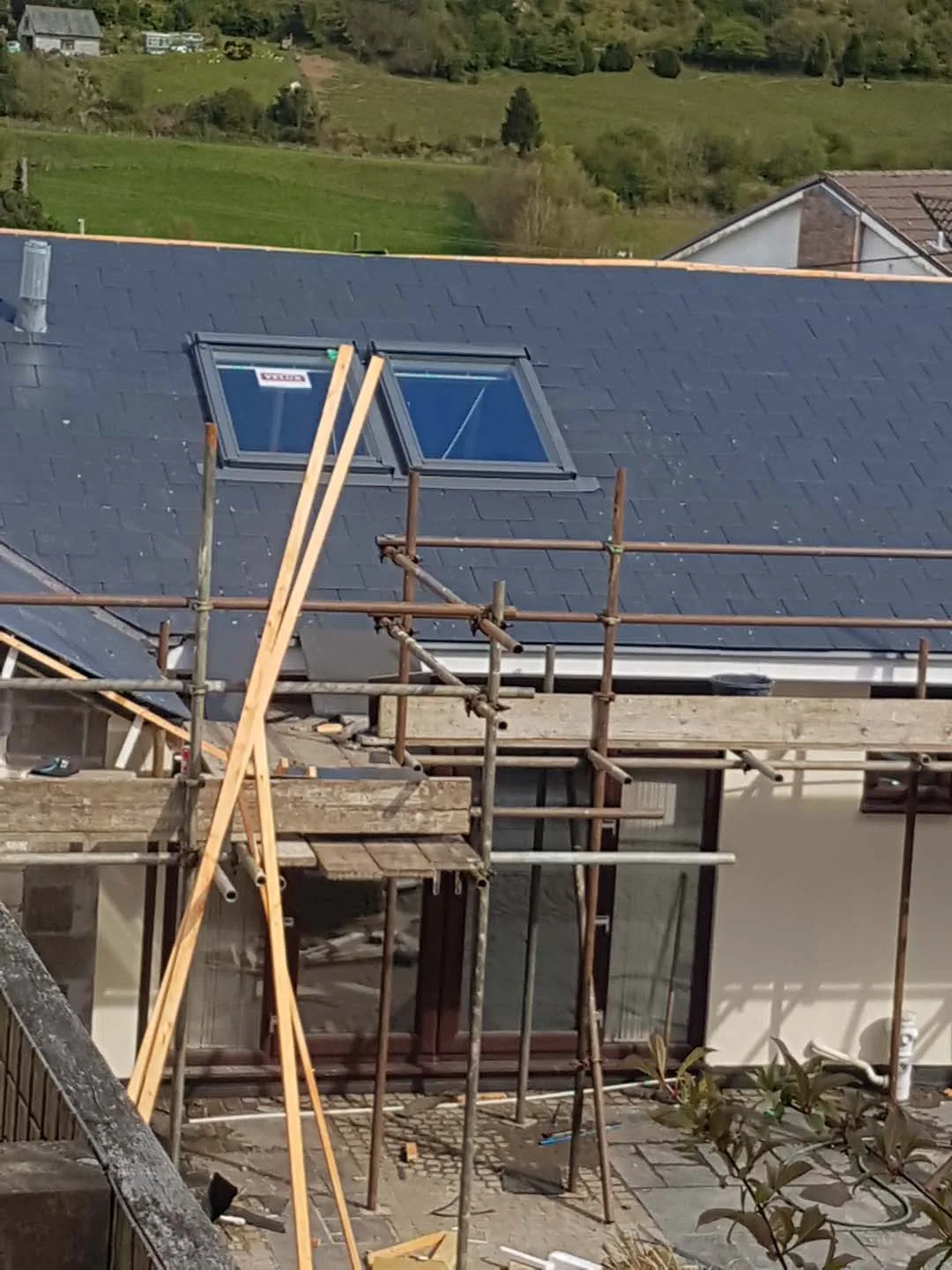 Twin roof windows fitted into a slate roof